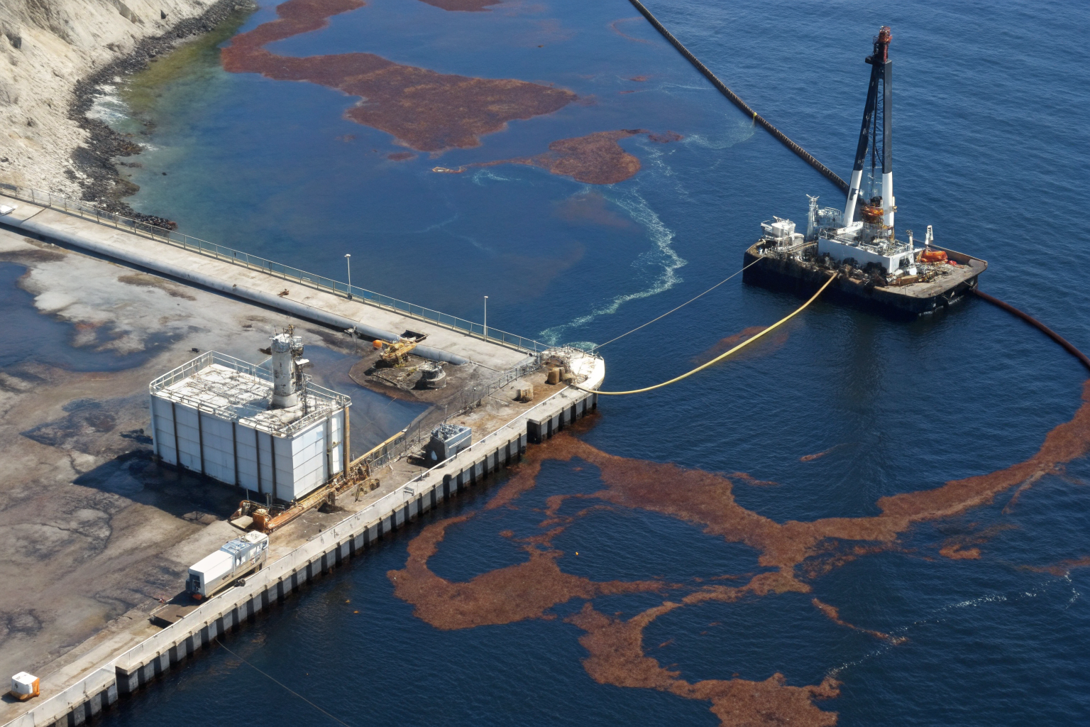 Containment system with oil spill showing inadequate capacity under EPA standards.