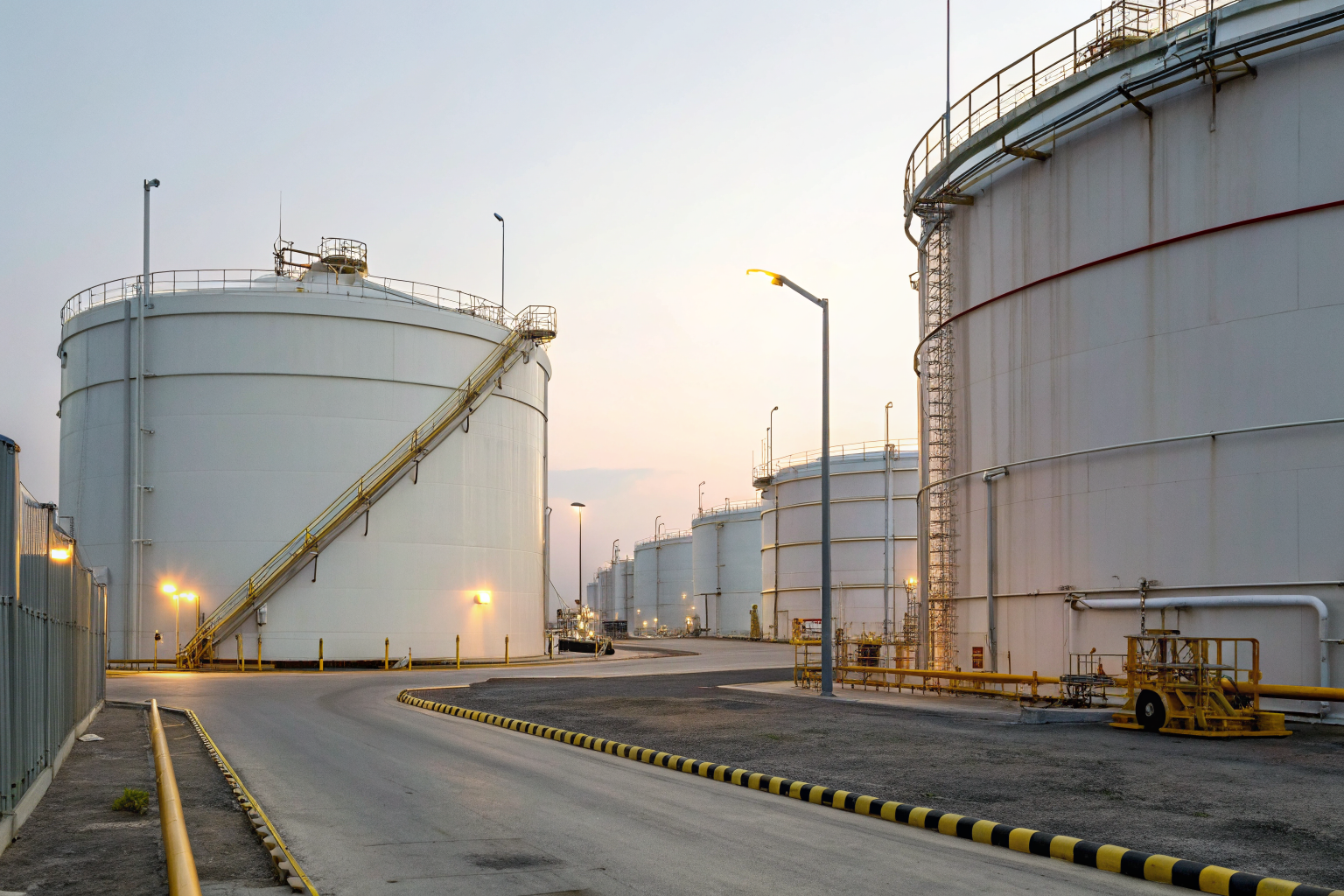 Oil storage facility with SPCC compliance signage and safety procedures.