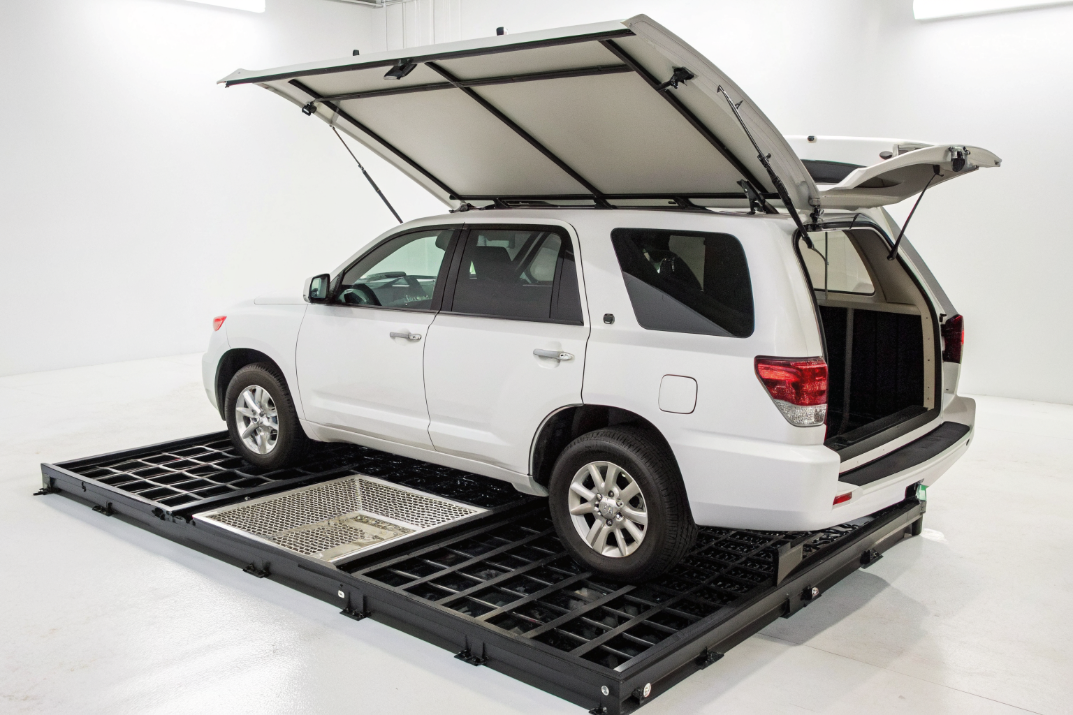 Integrated spill containment and hard top coverage system.