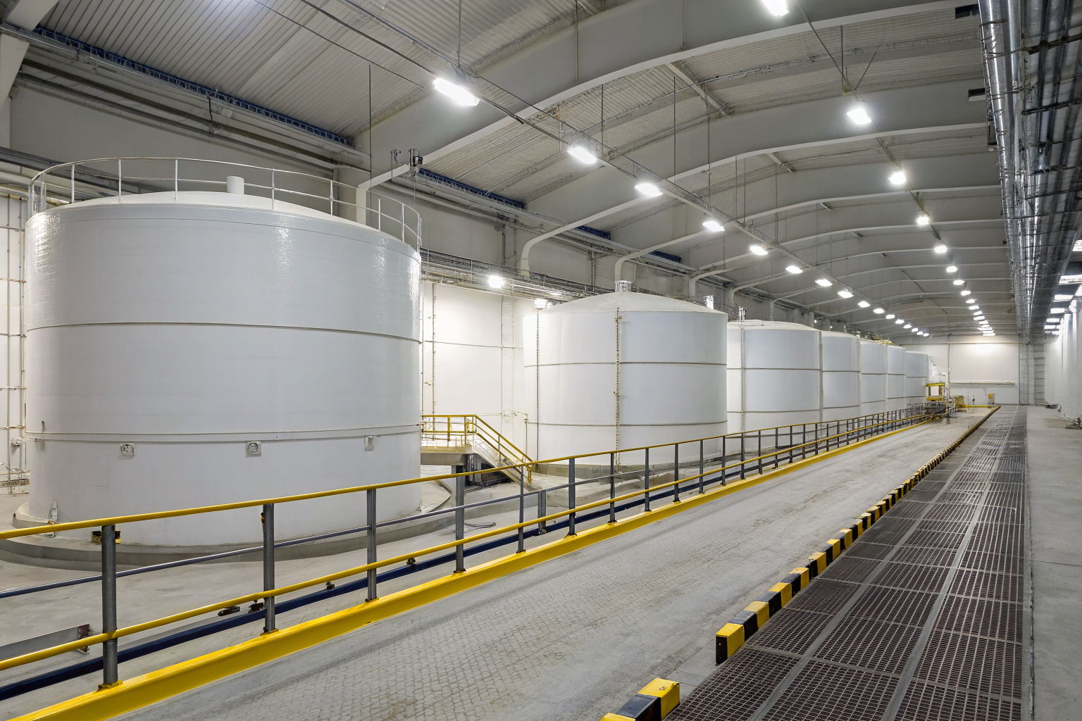 Tank storage area with secondary containment for environmental protection.