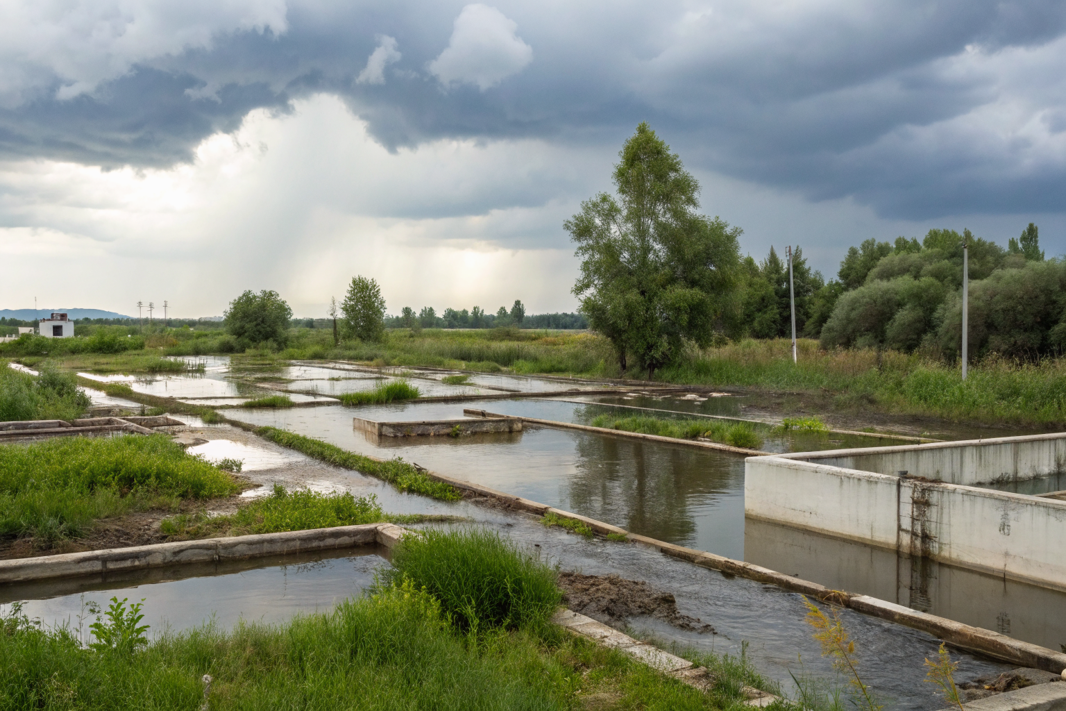 Containment area with heavy precipitation causing drainage issues.