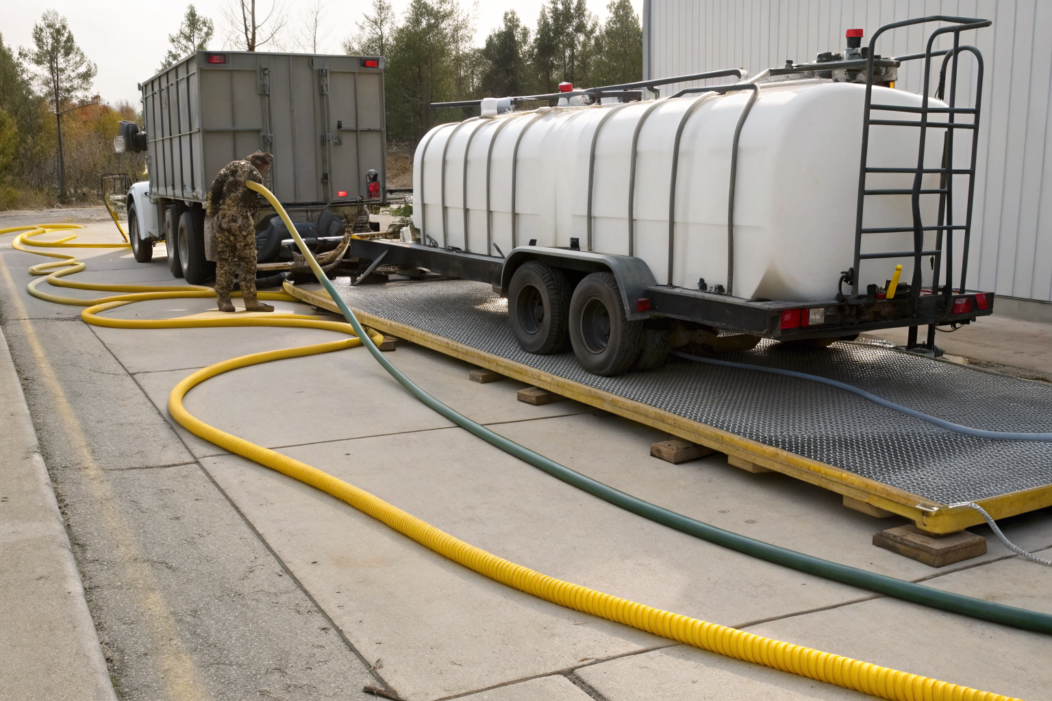 Mobile refueling operation with secondary containment system to prevent spills.