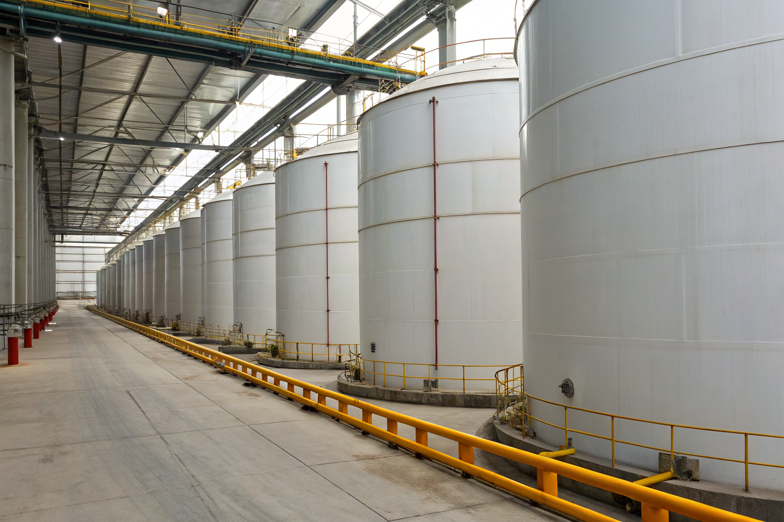 Large oil storage containers in a manufacturing facility.