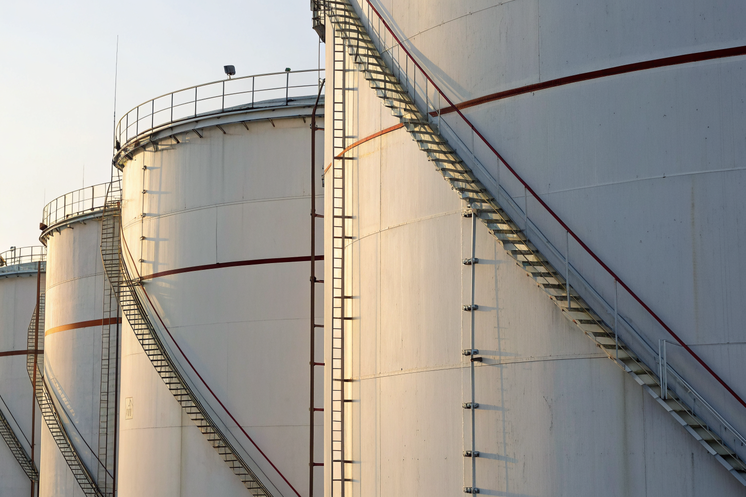 Close-up of storage tanks with measurement markers for tier limits.