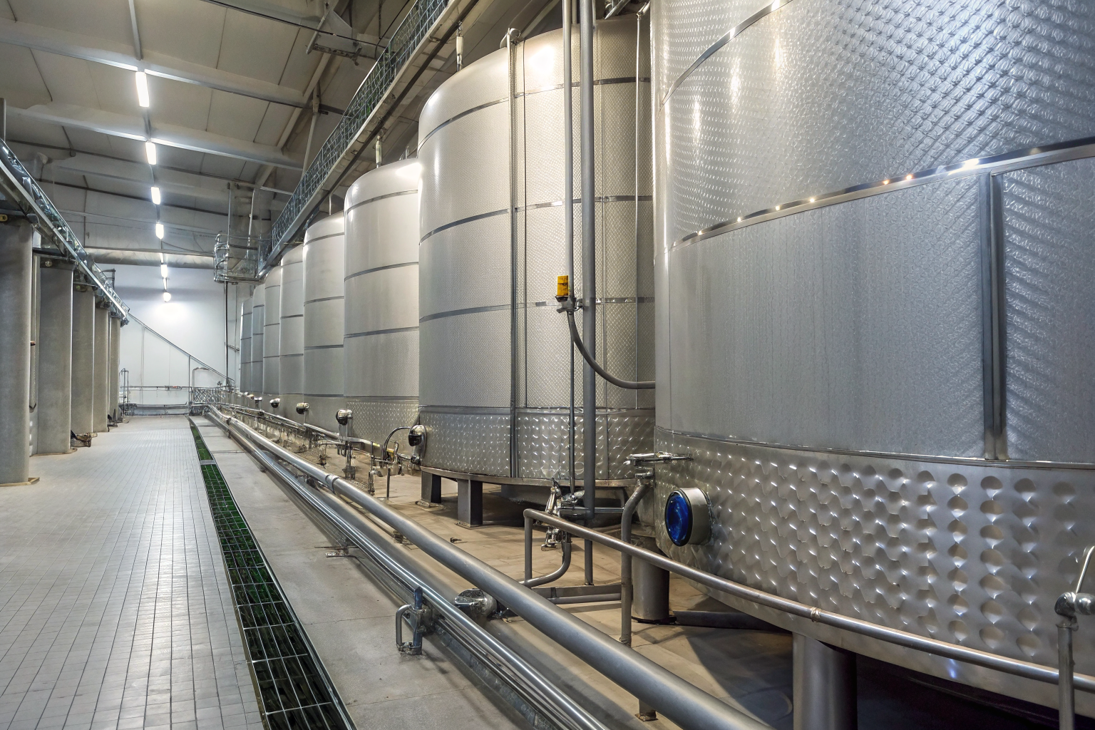Secondary containment system for vegetable oil storage with visible engineering calculations.